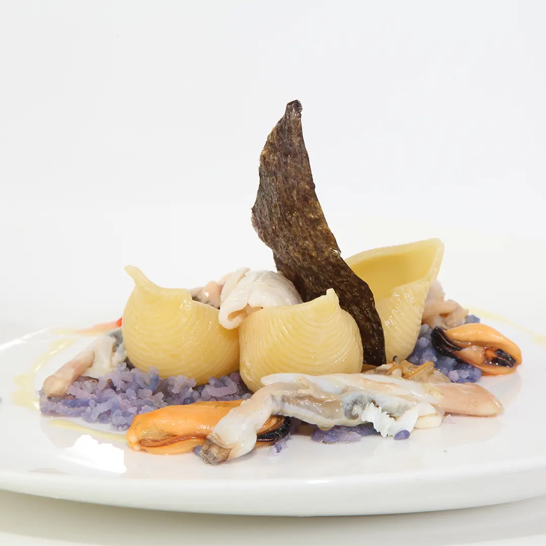 Ricetta Conchiglioni con patate, cozze, vongole, seppioline e calamari